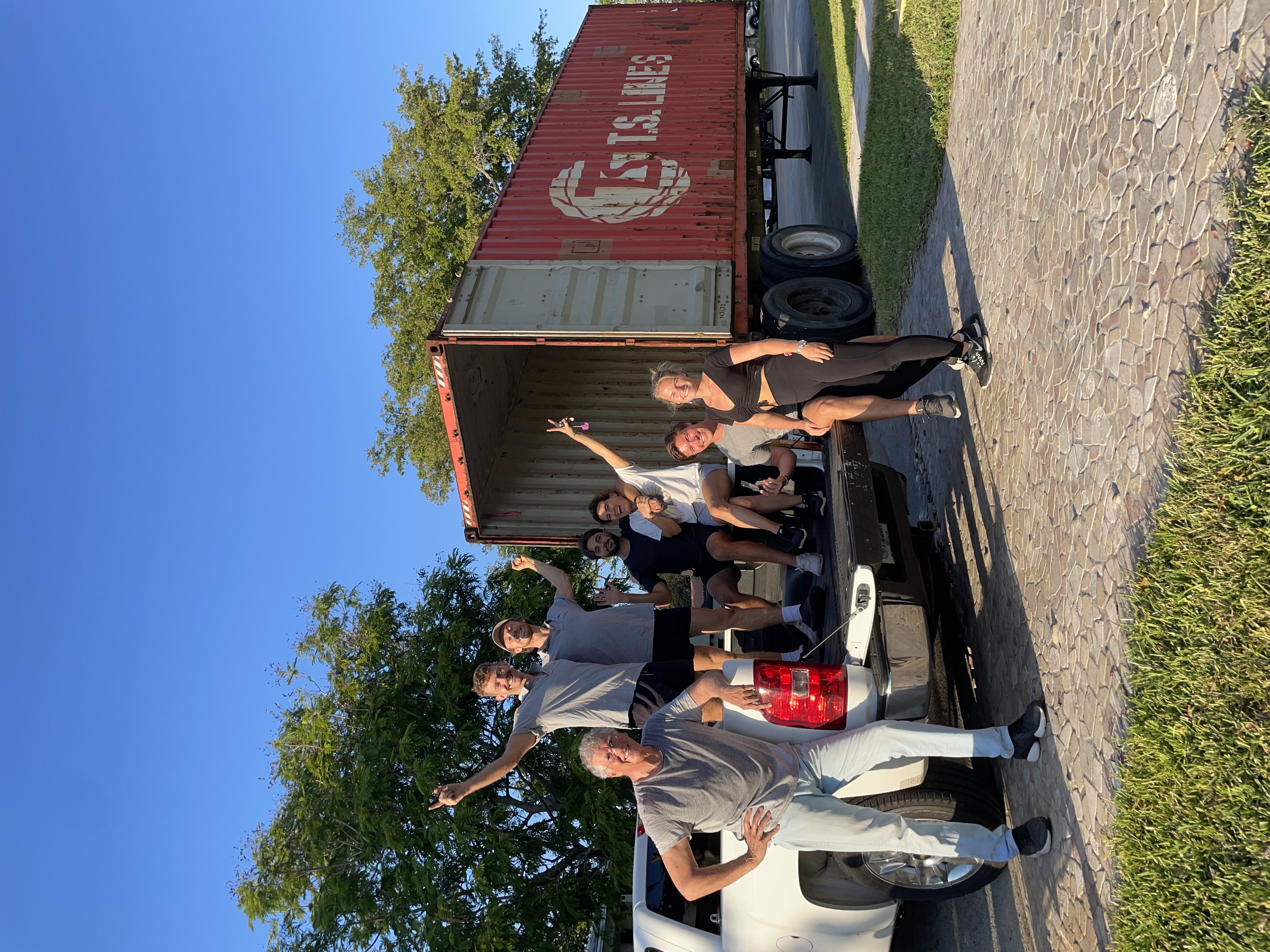 Brian and Vincent Moulton with a happy customer after completing a move in Miami