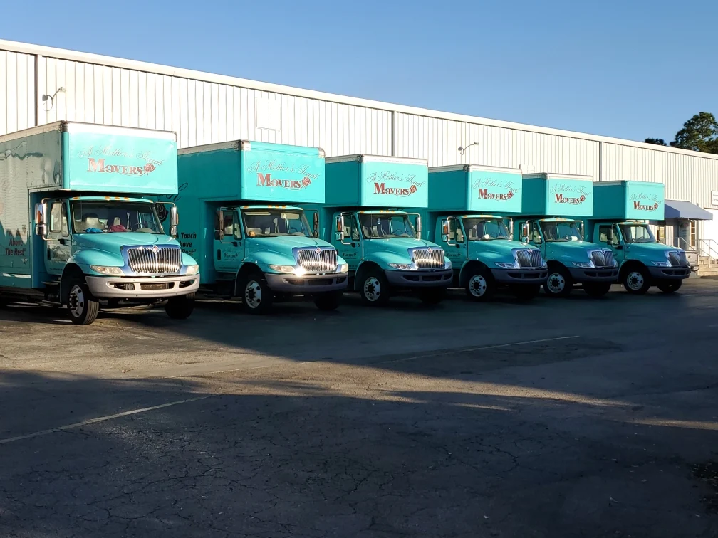 A Mother's Touch Moving fleet of six trucks lined up outside the Melbourne, Florida warehouse